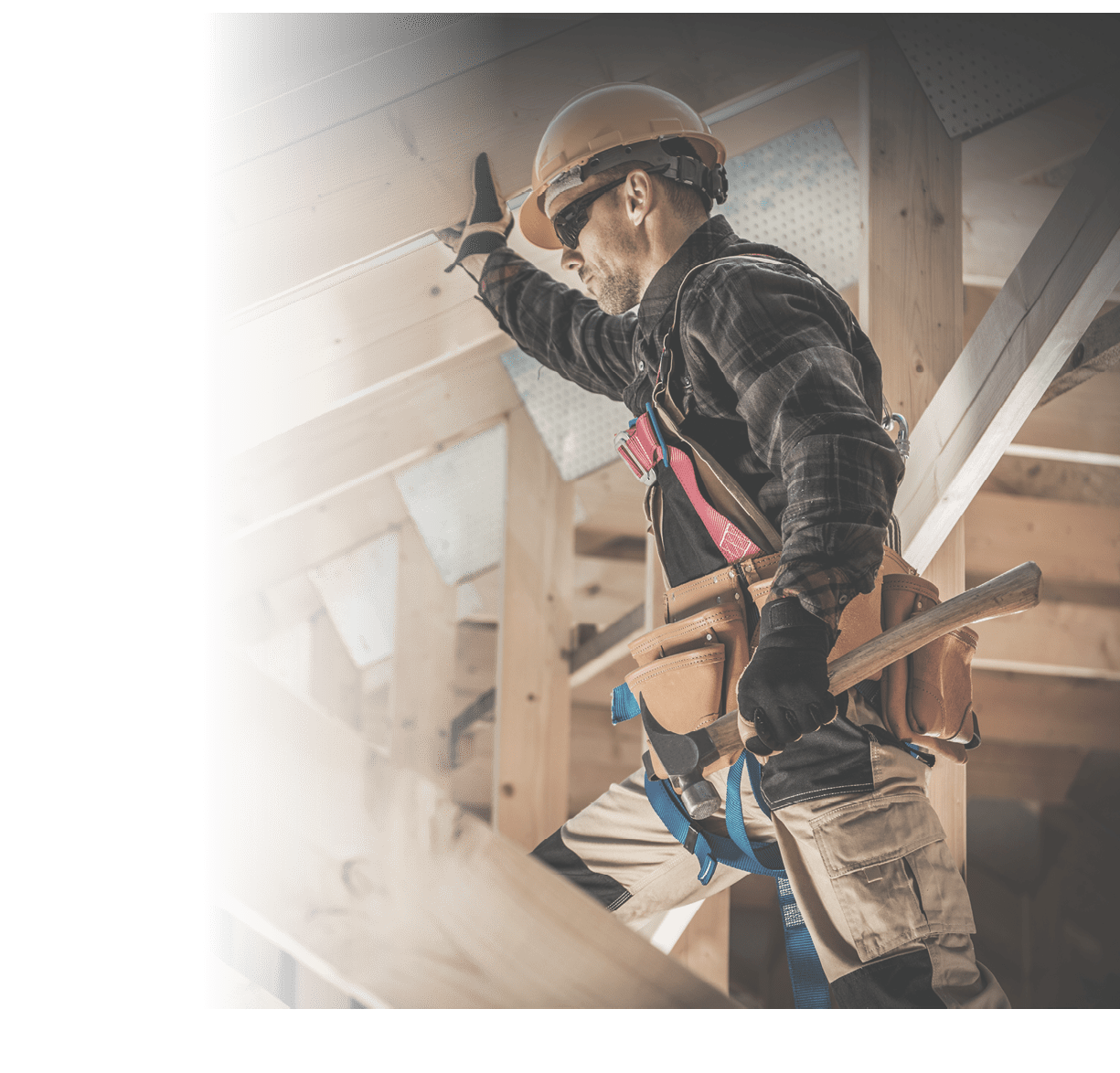 Construction Worker on Duty. Caucasian Contractor and the Wooden House Frame. Industrial Theme.